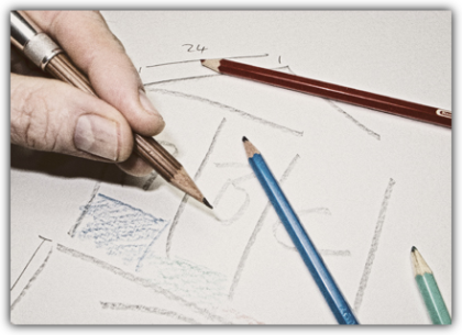 The image shows a left hand holding a pencil over a sketch of a model, with brown, blue, and green colored pencils lying nearby. When you hover over the image, a brief description appears: Thematize - Derive your goals from the core problem, causes, and consequences in the topic structure. Organize them and document the expected effects.<br />©memephoto