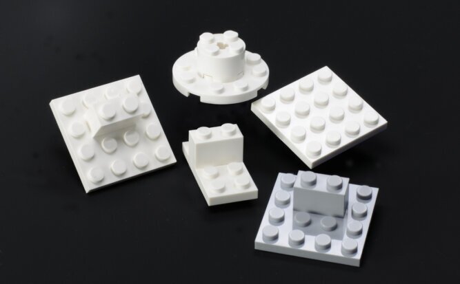 The photo shows a puzzle with five Lego structures, one of which is different from the rest.<br />©memephoto
