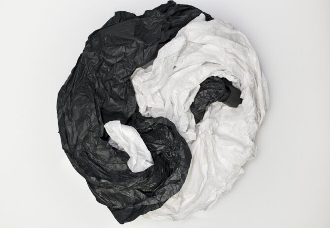 The photo shows a yin-yang object made of crumpled paper.<br />©memephoto